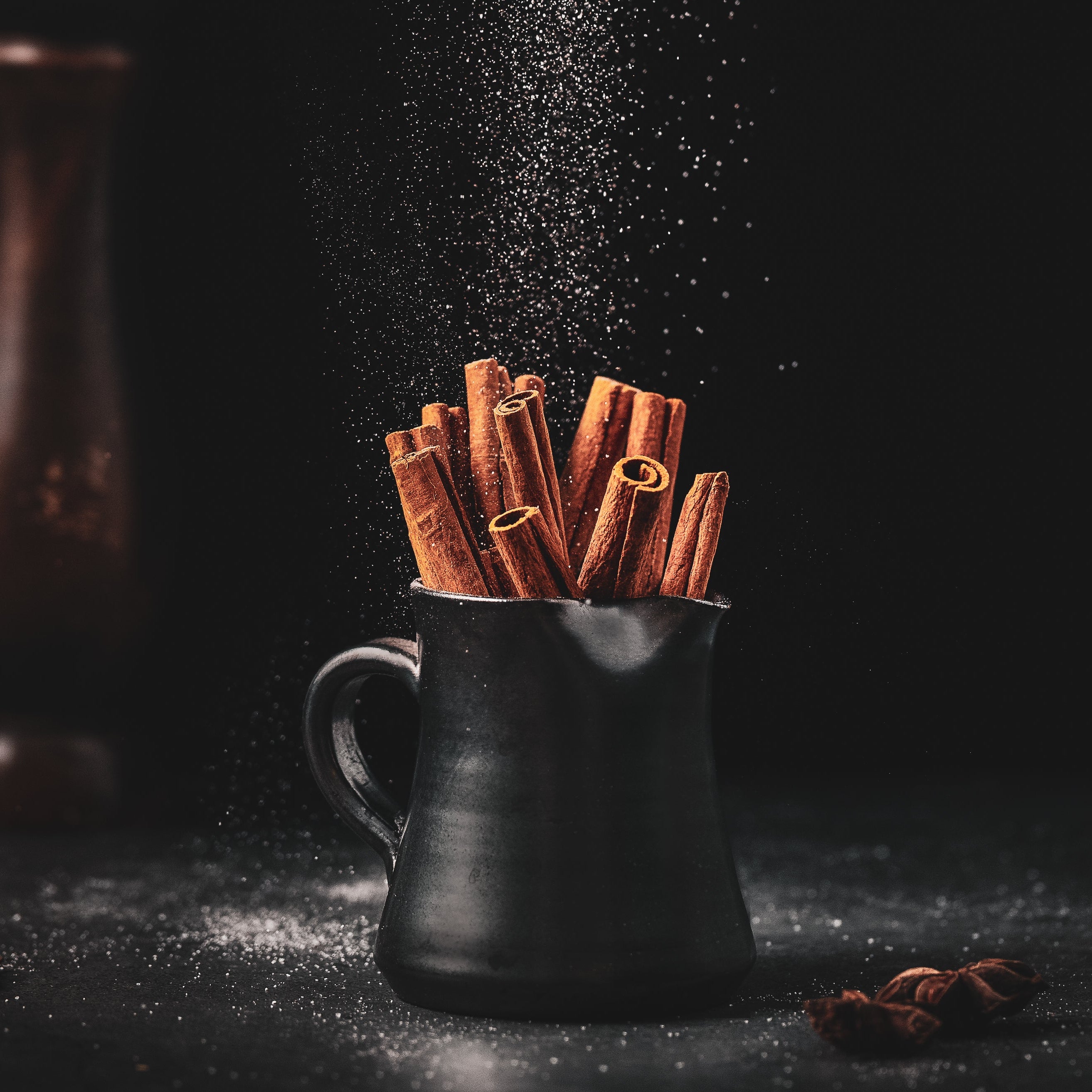 A glowing nighttime campfire under the stars, representing the Midnight Ember package of two single-origin coffees and the Midnight Ember flavored blend.